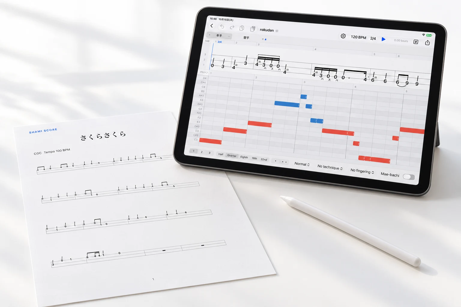 ShamiScoreの編集画面を表示したiPadと、印刷した「さくらさくら」の譜面のイメージ